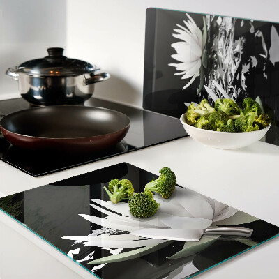 Tabla de cortar de cristal Nenúfares sobre fondo negro