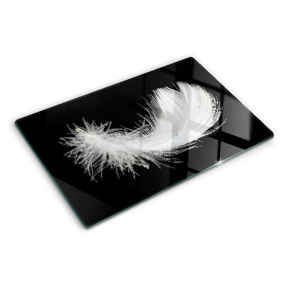 Tabla de cortar de cristal Pluma sobre fondo negro