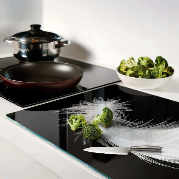 Tabla de cortar de cristal Pluma sobre fondo negro