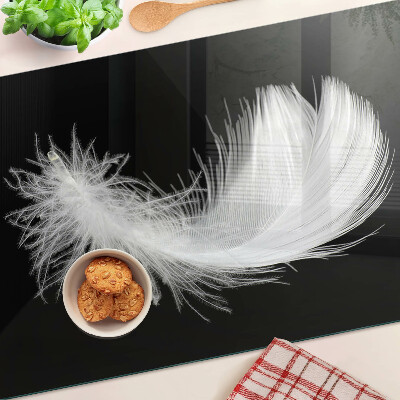 Tabla de cortar de cristal Pluma sobre fondo negro