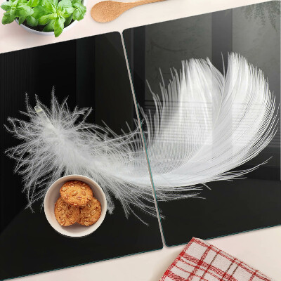 Tabla de cortar de cristal Pluma sobre fondo negro