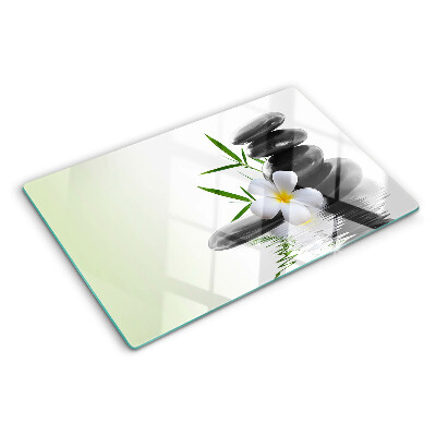 Tabla de cortar Flores y piedras en el agua.