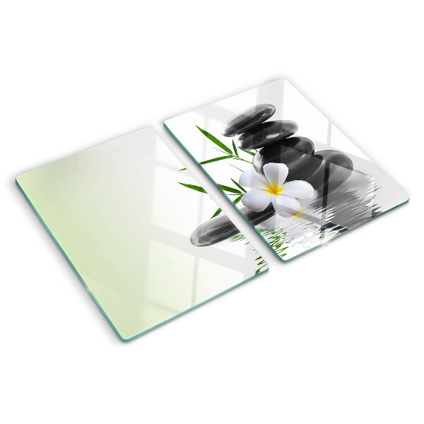 Tabla de cortar Flores y piedras en el agua.