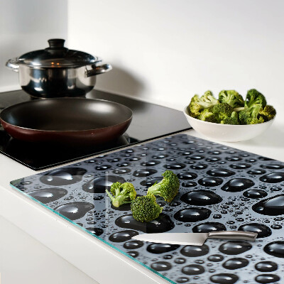 Tabla de cortar de cristal Gotas de agua sobre el vidrio