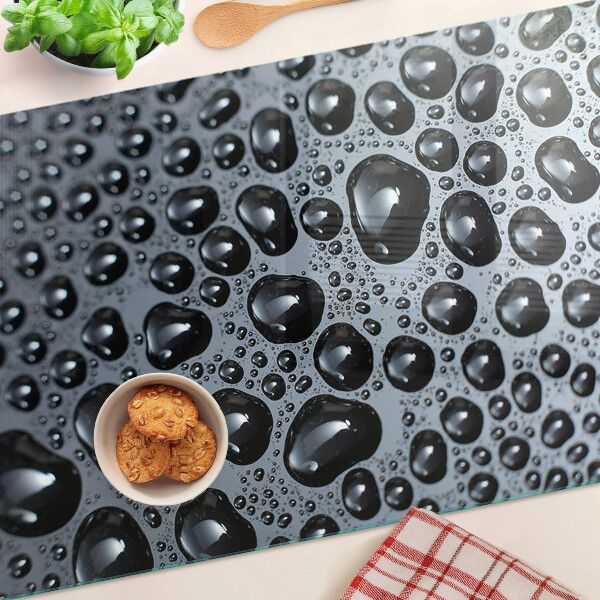 Tabla de cortar de cristal Gotas de agua sobre el vidrio