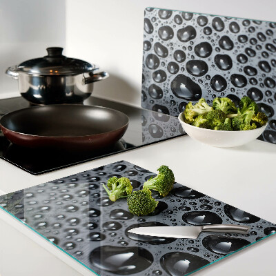 Tabla de cortar de cristal Gotas de agua sobre el vidrio