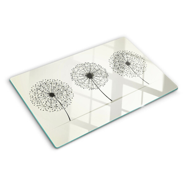 Tabla de cortar Dientes de león sobre un fondo blanco