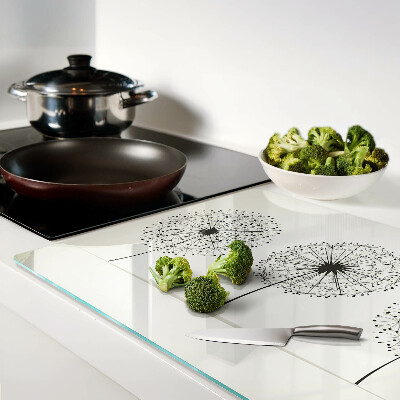 Tabla de cortar Dientes de león sobre un fondo blanco