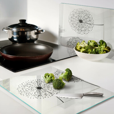 Tabla de cortar Dientes de león sobre un fondo blanco