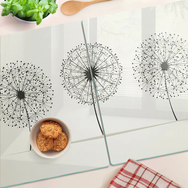 Tabla de cortar Dientes de león sobre un fondo blanco