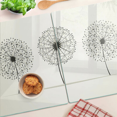 Tabla de cortar Dientes de león sobre un fondo blanco