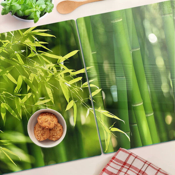 Tabla para cortar Hojas de bambú y follaje verde.