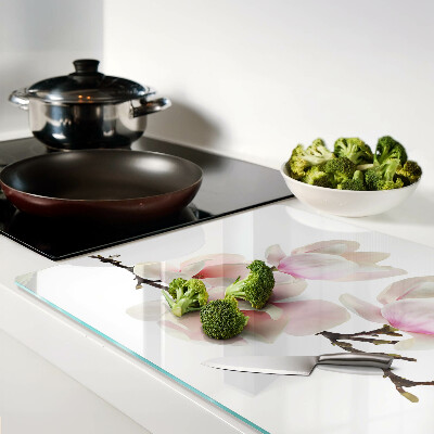 Tabla de cortar de cristal Flores de magnolia en una rama