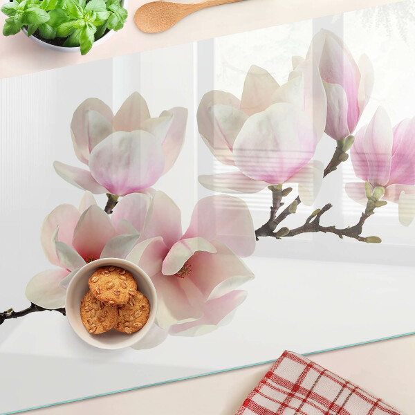 Tabla de cortar de cristal Flores de magnolia en una rama