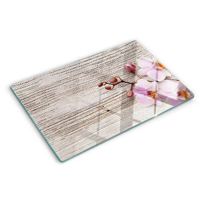 Tabla de cortar Orquídeas sobre un fondo de madera