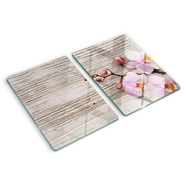 Tabla de cortar Orquídeas sobre un fondo de madera