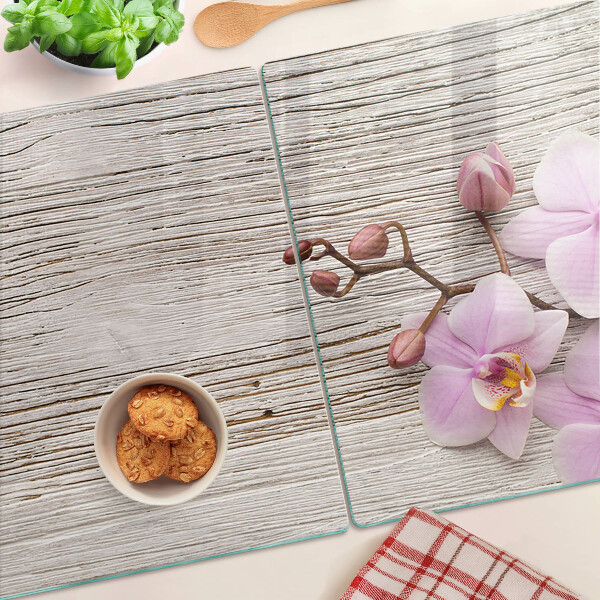 Tabla de cortar Orquídeas sobre un fondo de madera