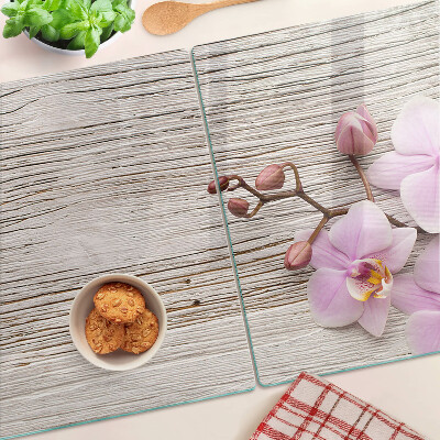 Tabla de cortar Orquídeas sobre un fondo de madera