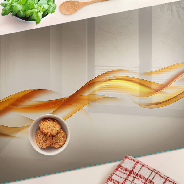 Szklana deska kuchenna Fale w odcieniach złota