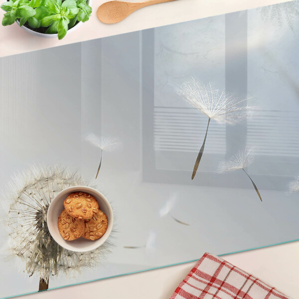 Deska kuchenna szklana Dmuchawce na tle okna