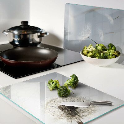 Deska kuchenna szklana Dmuchawce na tle okna