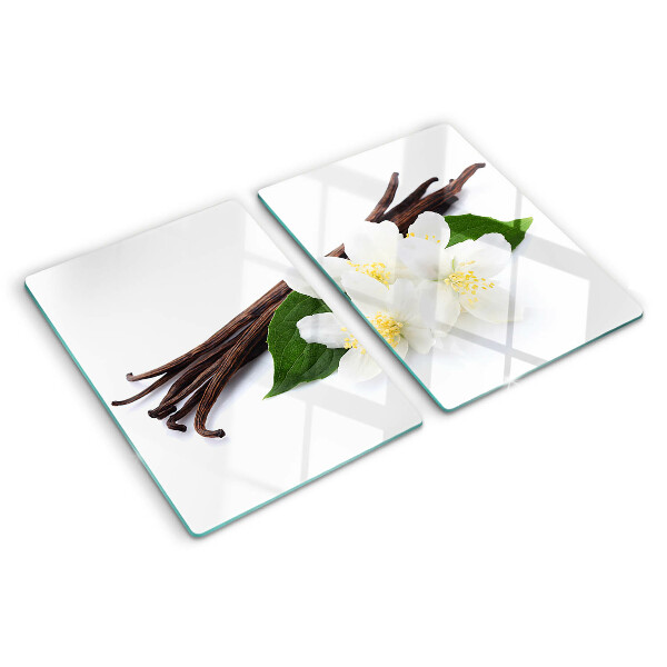 Tabla de cortar flores y vainas de vainilla