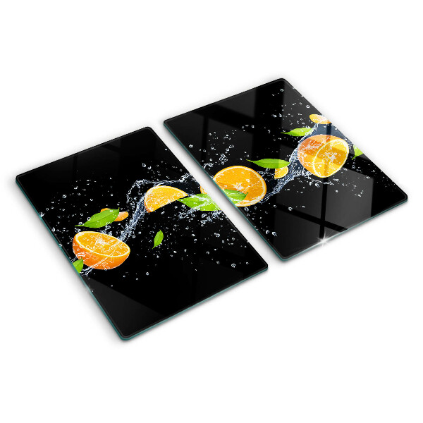 Tabla de cortar de cristal Frutas cítricas en agua