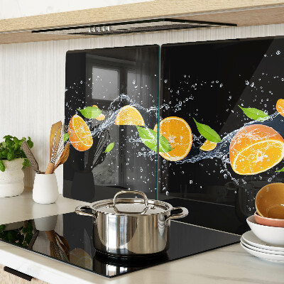 Tabla de cortar de cristal Frutas cítricas en agua