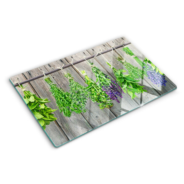 Tabla para cortar Hierbas secas sobre un fondo de madera