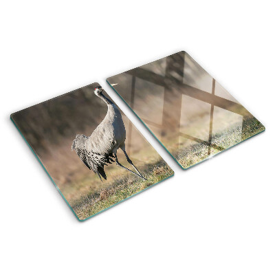 Tabla de cocina Una grúa con el telón de fondo de un paisaje.