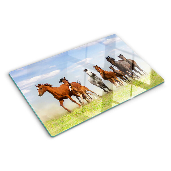 Tabla para cortar Caballos al galope en el prado