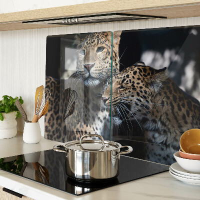 Tabla de cortar de cristal Guepardos sobre un fondo oscuro