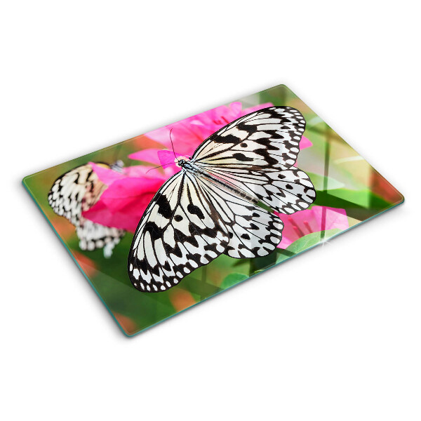 Tabla de cortar de cristal Mariposa sobre flores