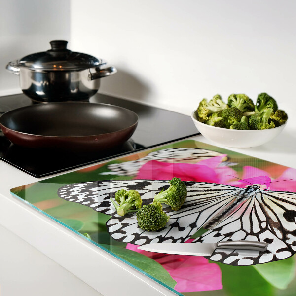 Tabla de cortar de cristal Mariposa sobre flores