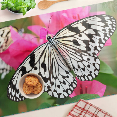 Tabla de cortar de cristal Mariposa sobre flores