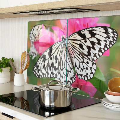 Tabla de cortar de cristal Mariposa sobre flores