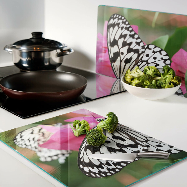 Tabla de cortar de cristal Mariposa sobre flores