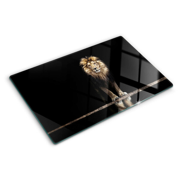 Tabla de cortar de cristal León sobre un fondo oscuro