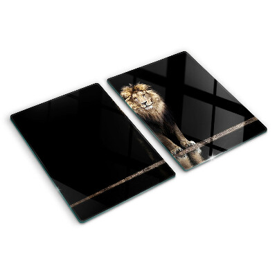 Tabla de cortar de cristal León sobre un fondo oscuro