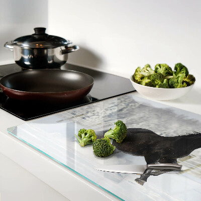 Tabla de cortar Un caballo en un paisaje invernal.