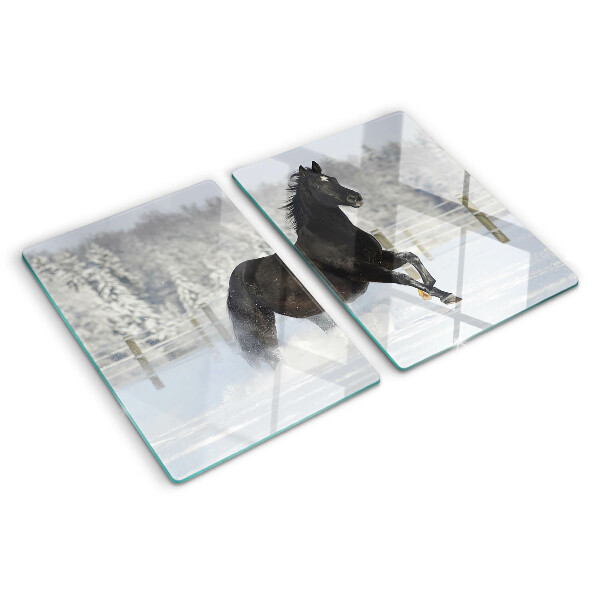 Tabla de cortar Un caballo en un paisaje invernal.