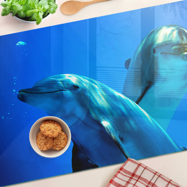 Tabla de cortar de cristal Delfines en el agua