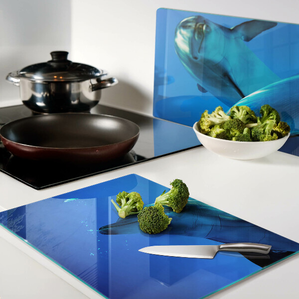 Tabla de cortar de cristal Delfines en el agua