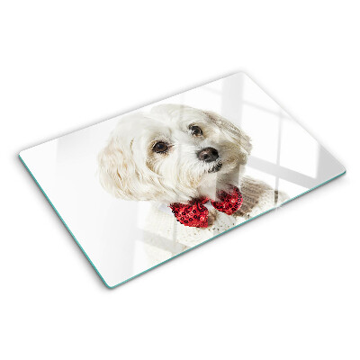 Tabla de cortar Un perro con un suéter con un lazo.