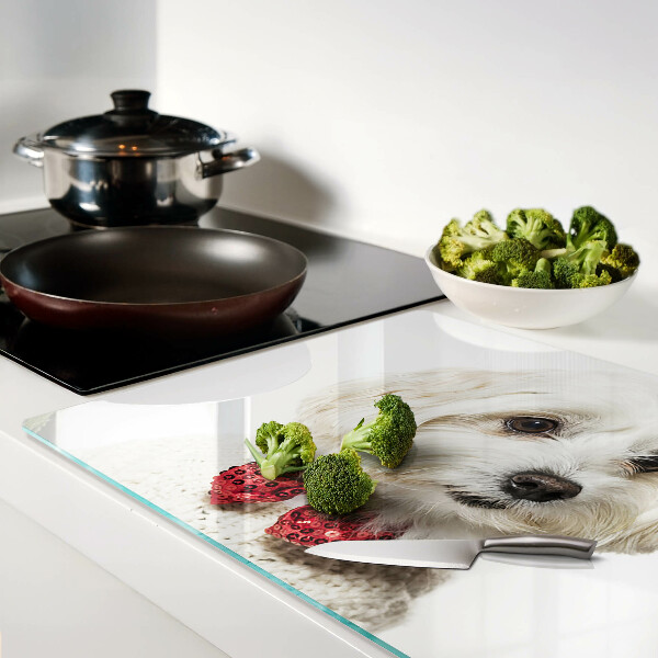 Tabla de cortar Un perro con un suéter con un lazo.