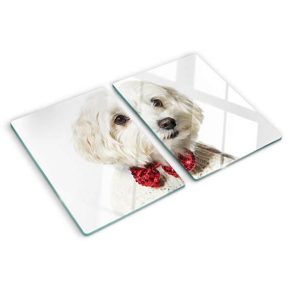 Tabla de cortar Un perro con un suéter con un lazo.