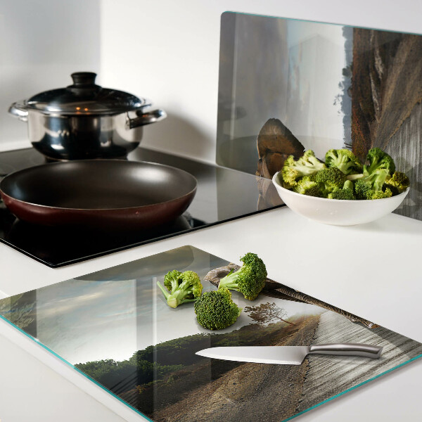 Tabla de cortar de cristal Elefante en la carretera al atardecer