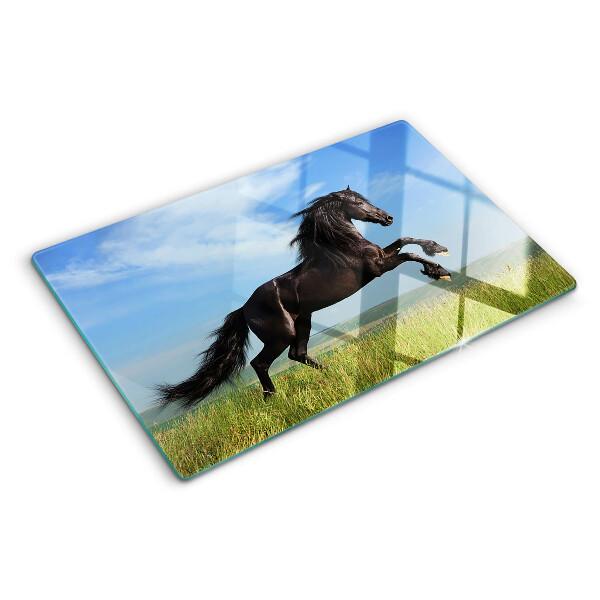 Tabla de cortar Caballo negro en el prado