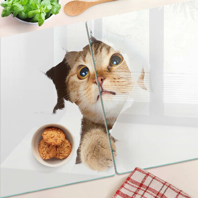 Tabla de cocina Un gato mirando a través de un agujero en la pared.