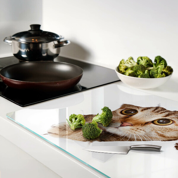 Tabla para cortar Un gato saliendo de un agujero